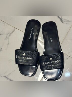 Navy blue Kate Spade slides in size 6, used but good condition.